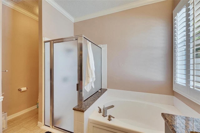 bathroom featuring crown molding, vanity, wood-type flooring, plus walk in shower, and a textured ceiling