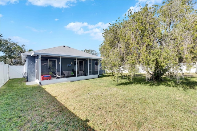 view of yard featuring a sunroom