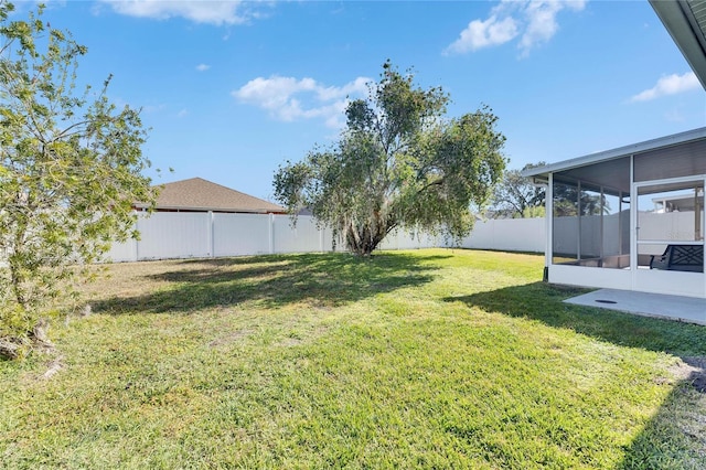 view of yard featuring a sunroom