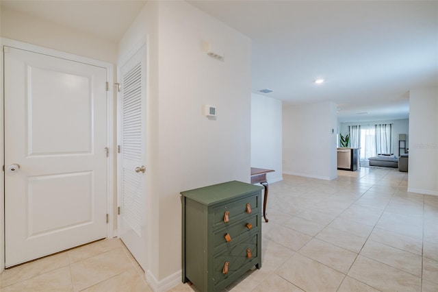 hallway with light tile patterned flooring