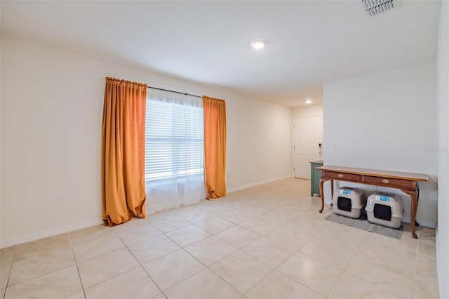 empty room with light tile patterned floors