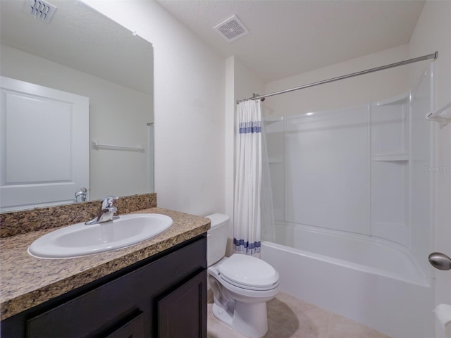 full bathroom featuring tile patterned flooring, vanity, shower / bath combo with shower curtain, and toilet