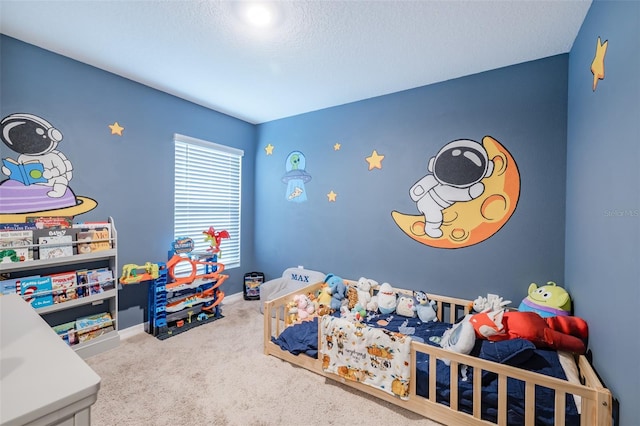 bedroom with a textured ceiling and carpet flooring