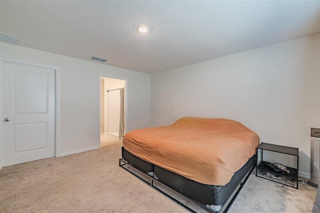 carpeted bedroom featuring a textured ceiling