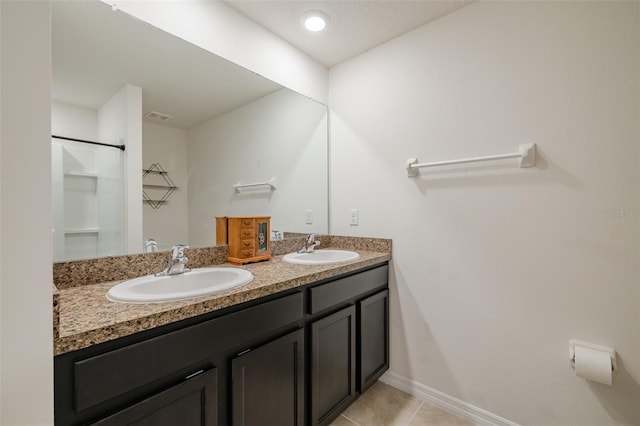 bathroom with vanity, tile patterned floors, and walk in shower