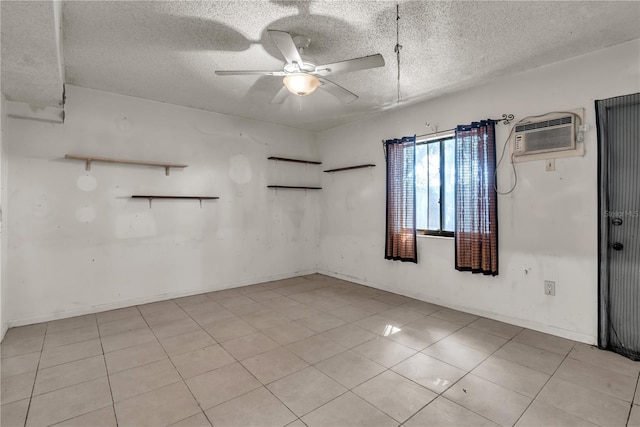 empty room with a wall mounted air conditioner, a textured ceiling, and ceiling fan