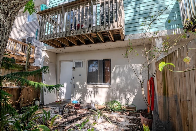 rear view of property featuring a balcony