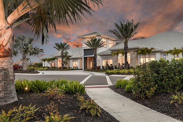 view of outdoor building at dusk