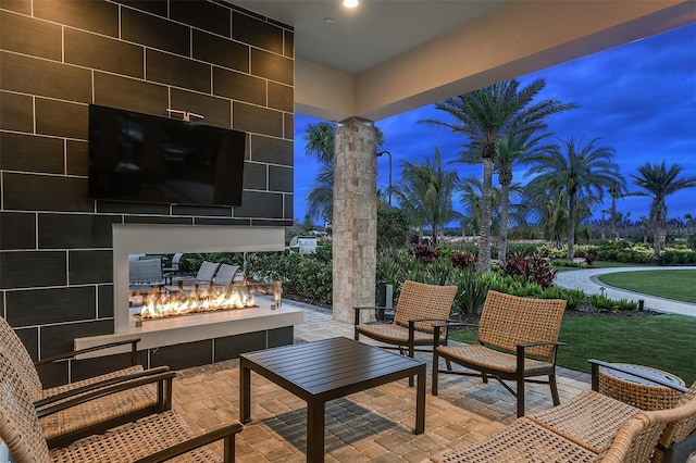 view of patio / terrace featuring an outdoor living space with a fire pit