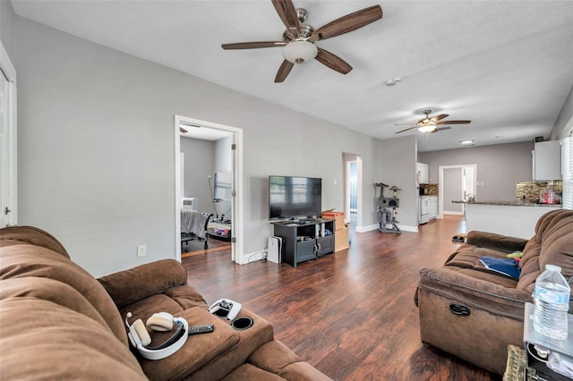 living room with dark wood-type flooring and ceiling fan