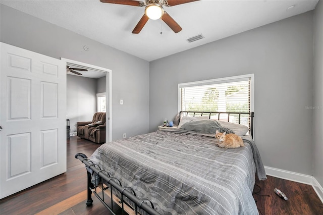 bedroom featuring dark hardwood / wood-style floors and ceiling fan