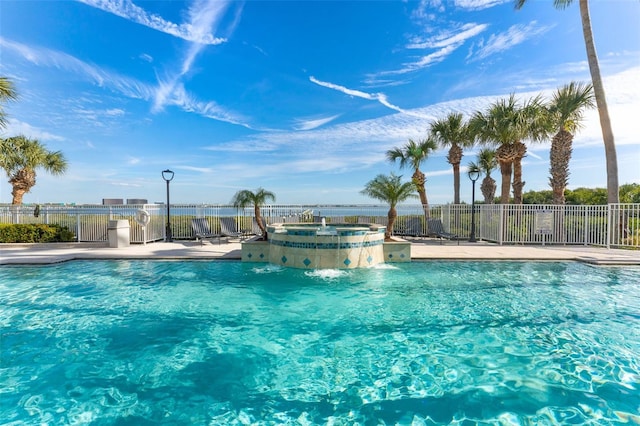1203 Bay Club Cir Unit 1203, Tampa, FL 33607 - community pool with a community hot tub, fence, and a patio