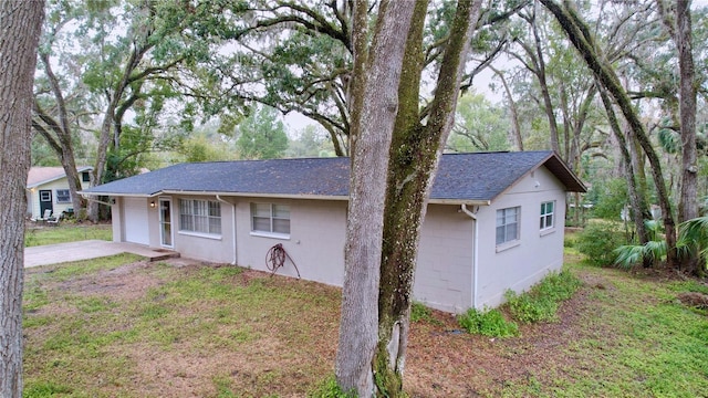 exterior space featuring a yard and a garage