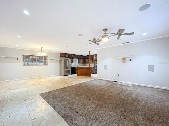 unfurnished living room featuring crown molding and ceiling fan with notable chandelier