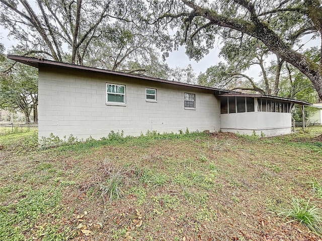 view of home's exterior with a yard