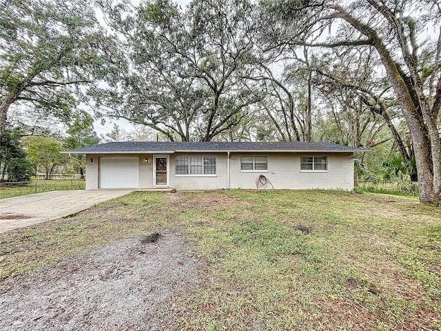 single story home with a garage and a front yard