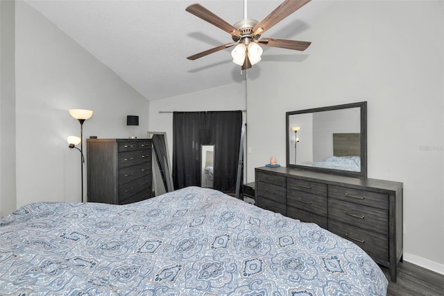 bedroom featuring ceiling fan, vaulted ceiling, and dark hardwood / wood-style flooring