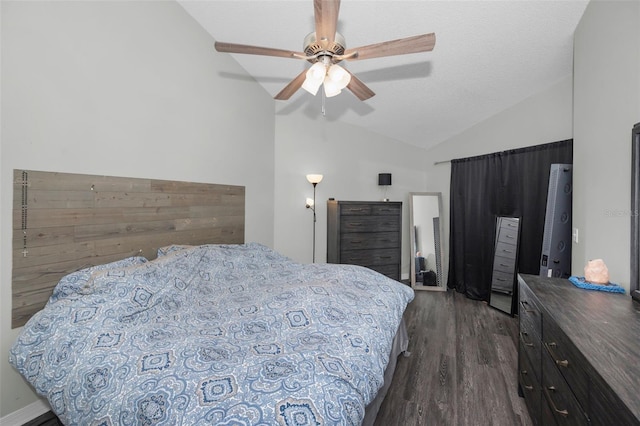 bedroom with ceiling fan, lofted ceiling, a textured ceiling, and dark hardwood / wood-style floors