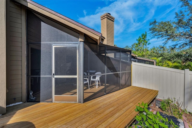 deck with a sunroom