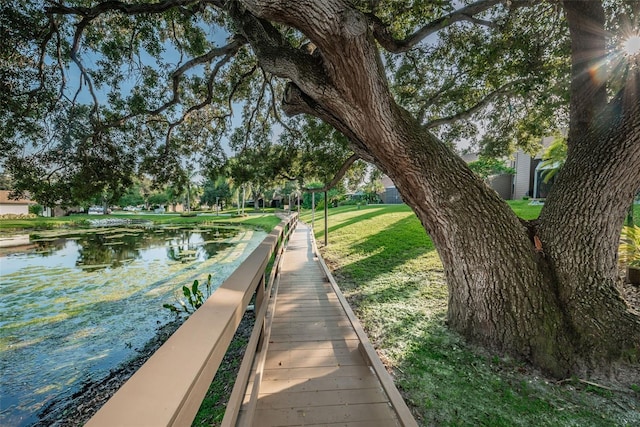 exterior space featuring a yard and a water view