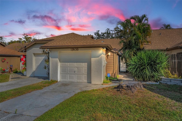 ranch-style home with a lawn