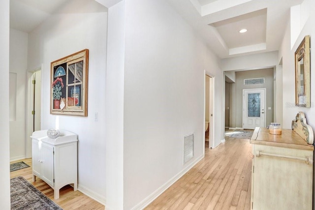 hallway with light hardwood / wood-style flooring