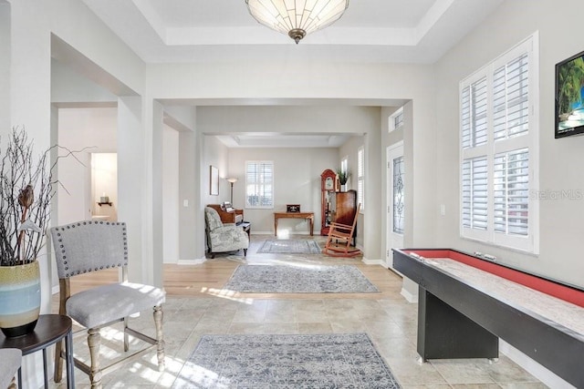 foyer featuring a tray ceiling