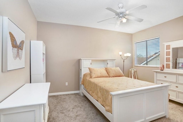 bedroom featuring light carpet and ceiling fan