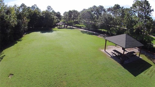 view of property's community with a yard and a gazebo