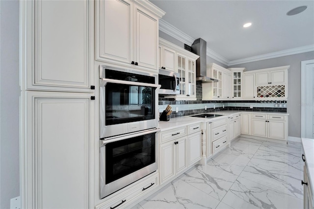 kitchen featuring tasteful backsplash, wall chimney range hood, crown molding, and appliances with stainless steel finishes