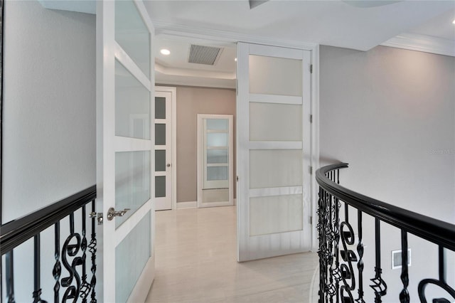 hall with crown molding and light wood-type flooring