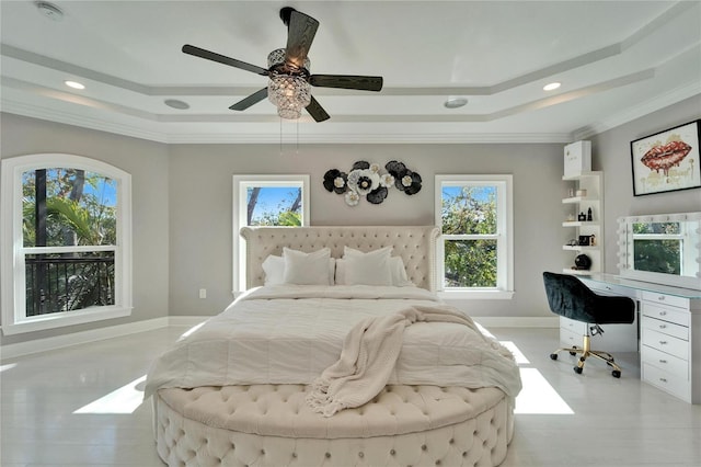 bedroom with crown molding, a raised ceiling, and multiple windows