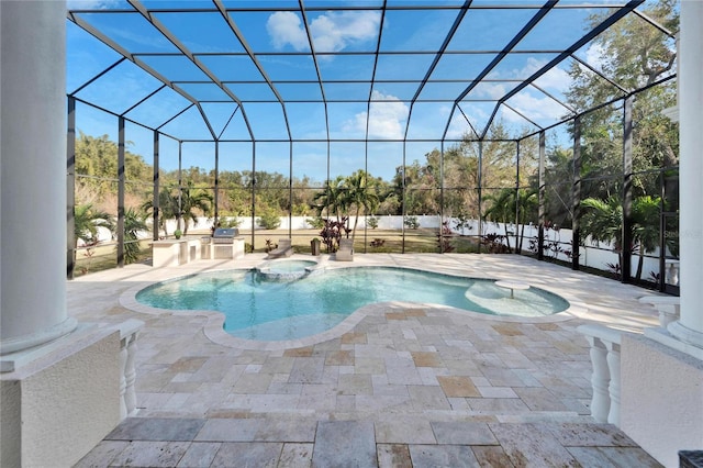 view of swimming pool featuring exterior kitchen, an in ground hot tub, glass enclosure, and a patio area