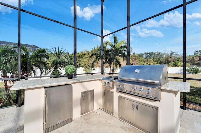 view of patio / terrace with area for grilling and an outdoor kitchen