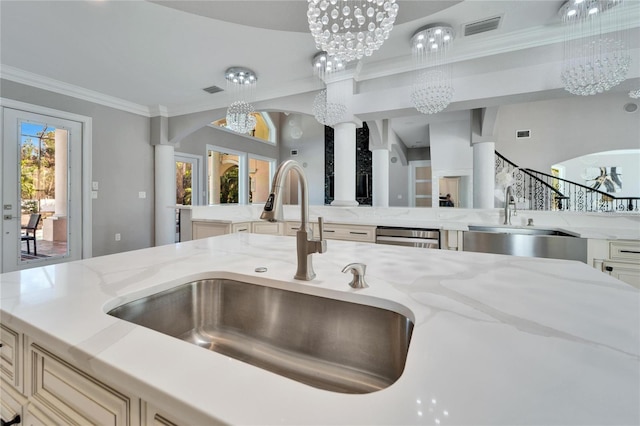 9401 93rd St, Seminole, FL 33777 - kitchen view of a sink, a chandelier, light stone counters, and ornamental molding
