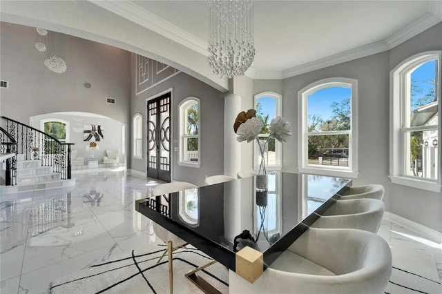 9401 93rd St, Seminole, FL 33777 - dining area with arched walkways, marble tiled flooring, stairway, ornamental molding, and a chandelier