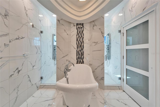9401 93rd St, Seminole, FL 33777 - full bathroom with tile walls, a freestanding tub, marble tiled floors, a marble finish shower, and a sink