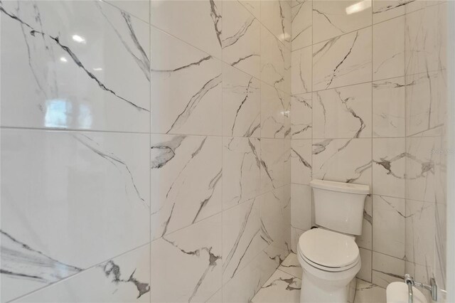 9401 93rd St, Seminole, FL 33777 - bathroom with toilet and marble finish flooring