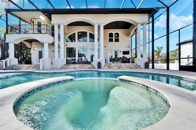 9401 93rd St, Seminole, FL 33777 - view of swimming pool with a patio, a pool with connected hot tub, glass enclosure, and area for grilling