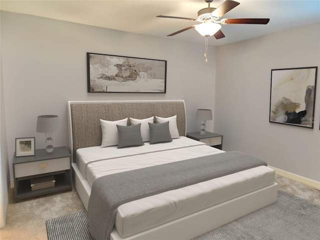 bedroom with ceiling fan and light colored carpet