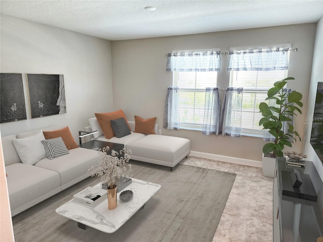 living room featuring light colored carpet, plenty of natural light, and a textured ceiling