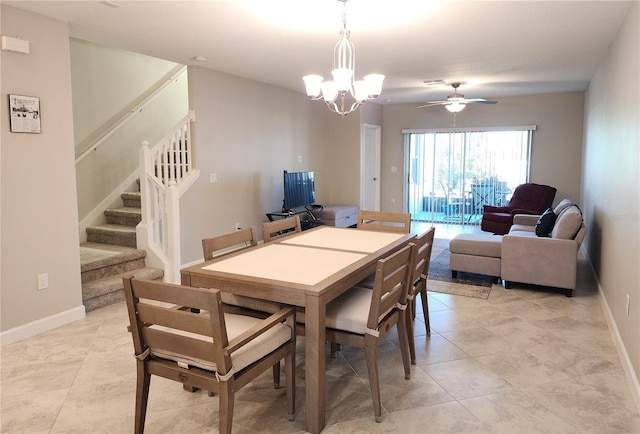 dining room featuring stairs, baseboards, light tile patterned floors, ceiling fan with notable chandelier, and visible vents