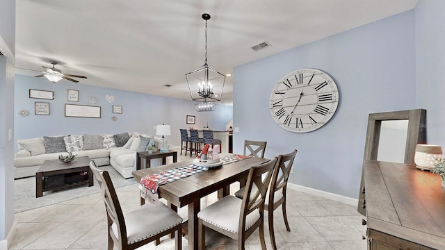 tiled dining space featuring ceiling fan