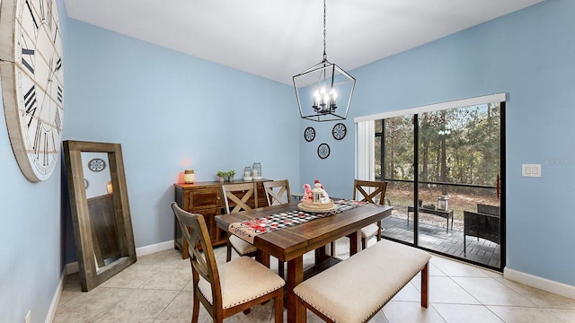 tiled dining room with an inviting chandelier