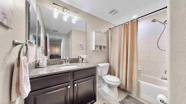 full bathroom featuring vanity, toilet, and shower / tub combo