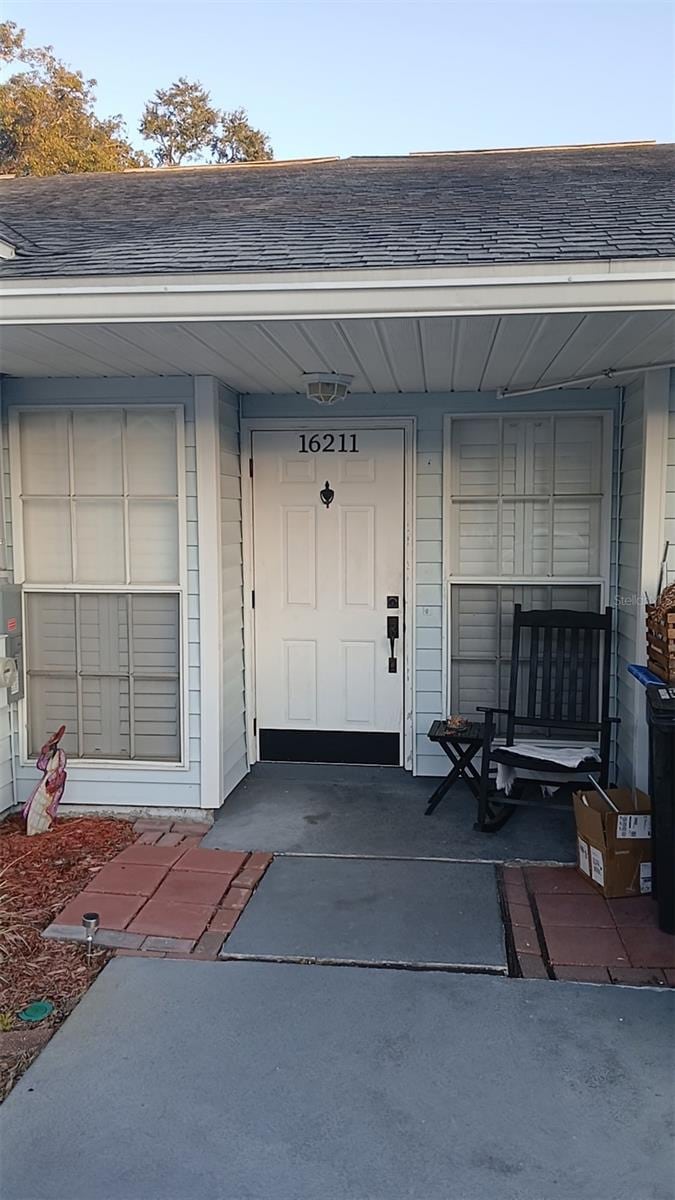 doorway to property with a porch