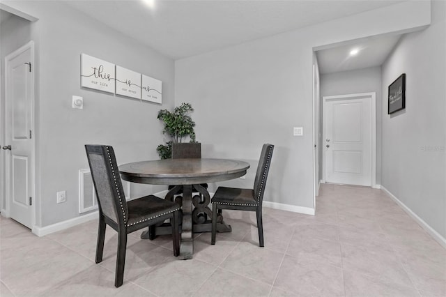 dining space with light tile patterned floors