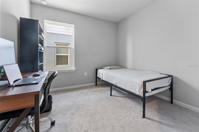 bedroom with light carpet