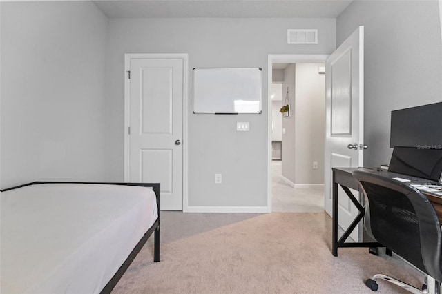 bedroom featuring light carpet