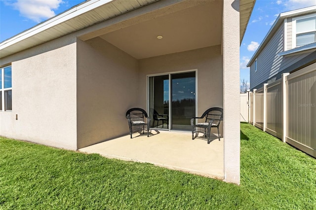 back of property with a patio and a yard